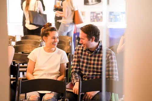 Attendees chat during a zero waste event.