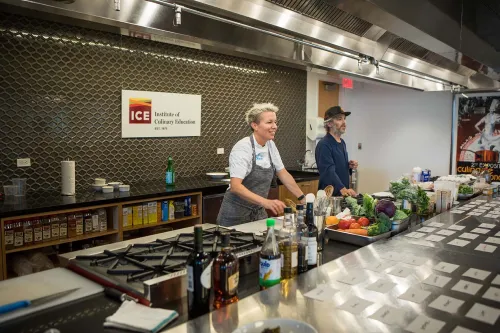 An instructor in an ICE kitchen during the zero waste event.