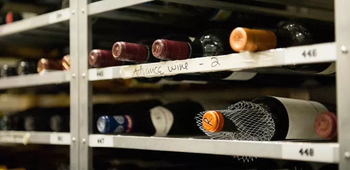 Bottles of wine on a shelf.