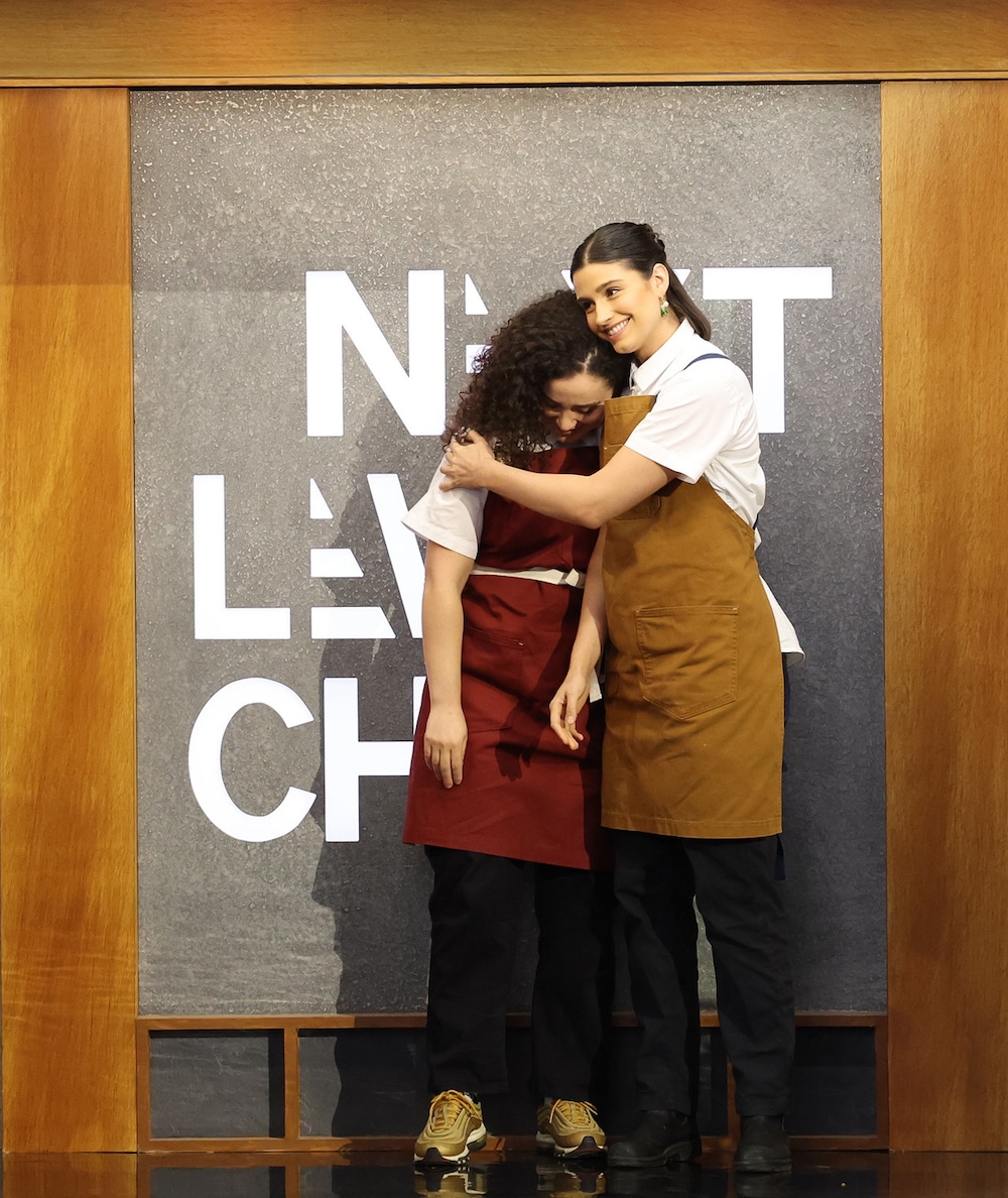 Chef Gabi Chappel hugs a fellow contestant on "Next Level Chef." CR: Lorraine O’Sullivan / FOX. ©2024 FOX Media LLC.