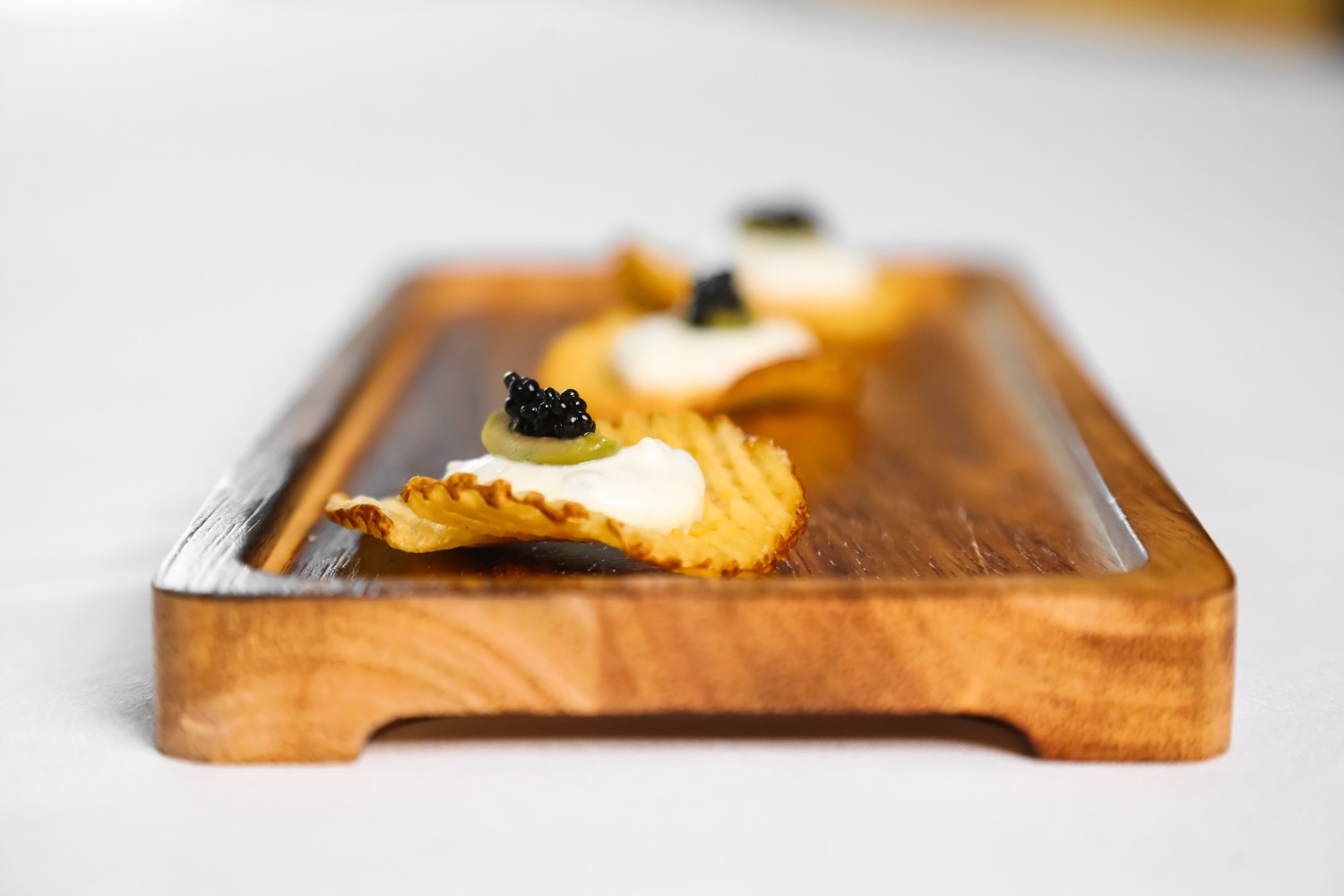Chips with caviar on top.