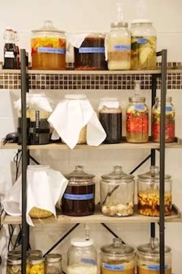 Vinegar jars on shelves.