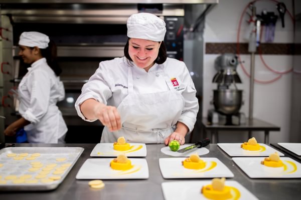 ICE student making pastry in the kitchen.