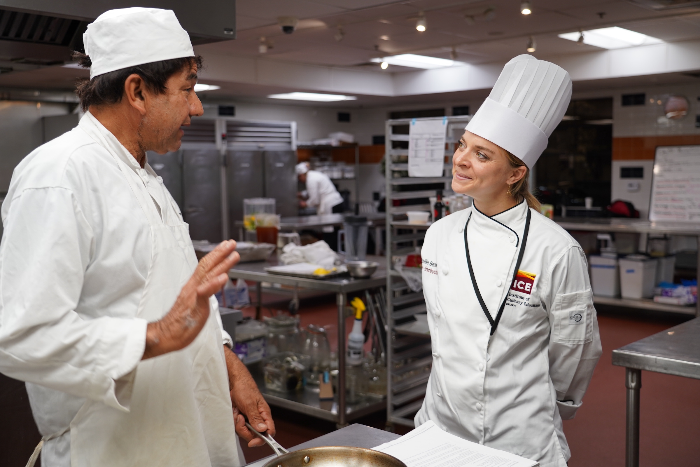 Chef Emilie talks to an ICE student in class