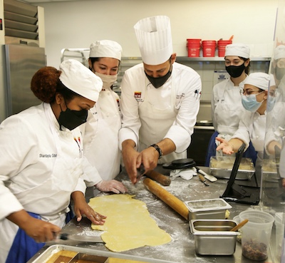 Chef Alon working with students