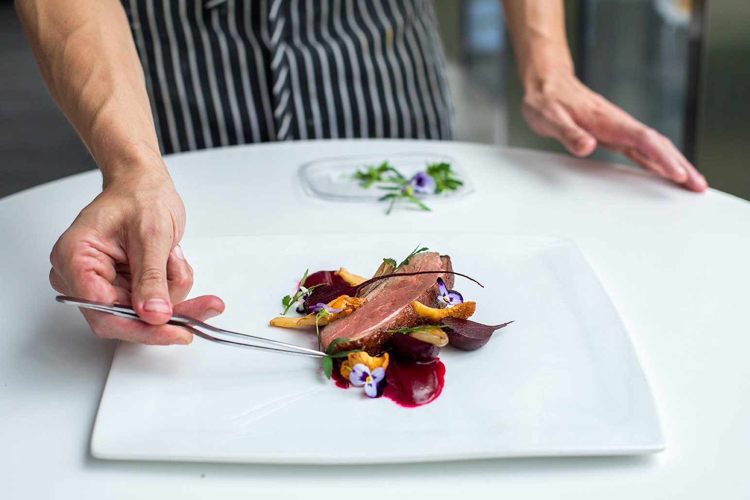 Chef Barry demonstrates plating for ICE students.