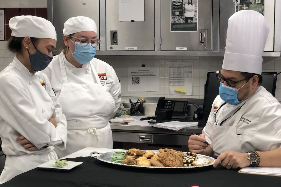 Chef Chavez giving pastry students notes on cookies