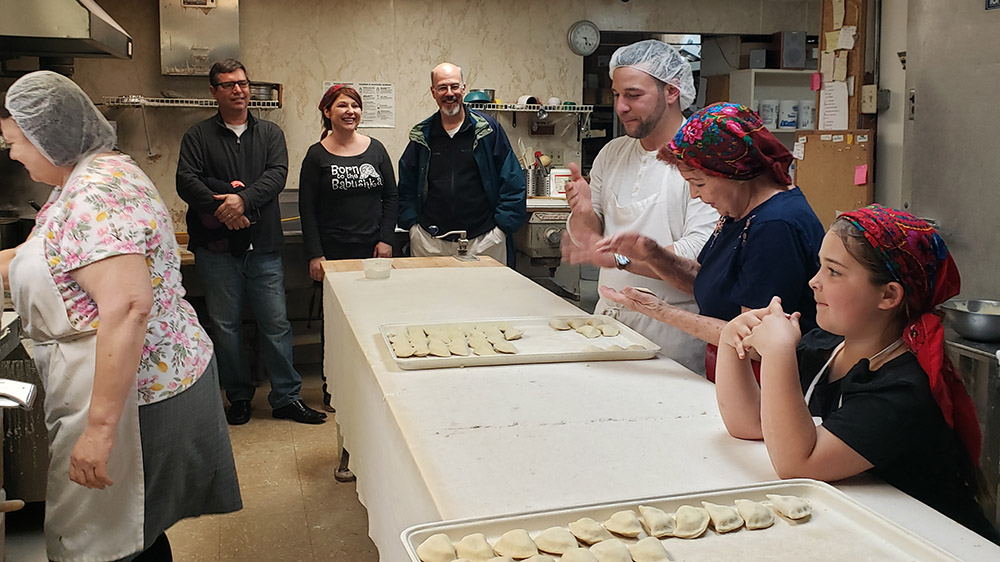 Dom films a segment making pierogis.