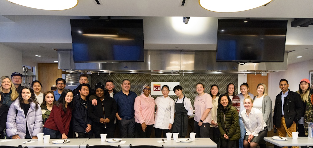 Eunji Lee poses with ICE students after an Elite Chef series demo.