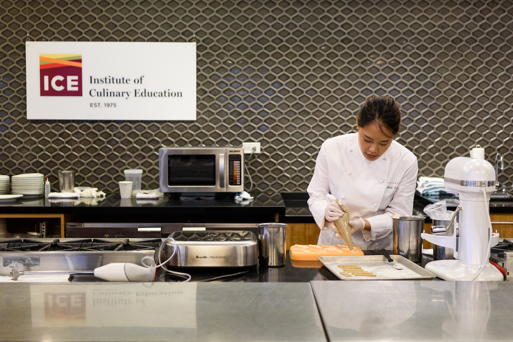 Eunji Lee fills her custom silicone molds during a demo at ICE.