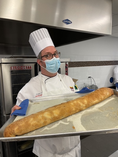 Chef Jurgen with a loaf of bread