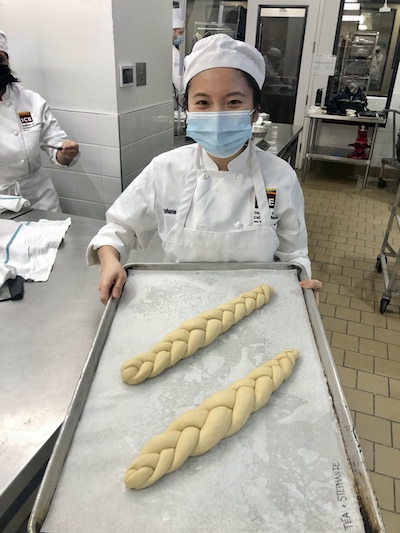 Stephanie Loo with braided bread at ICE