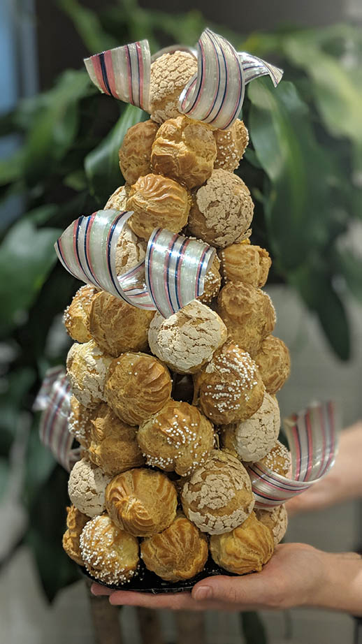 ICE pastry students Elizabeth Frentz, Pragati Mitta, Gianna Sampogna and Alexa Ventura made a festive croquembouche with Chef Kathryn.