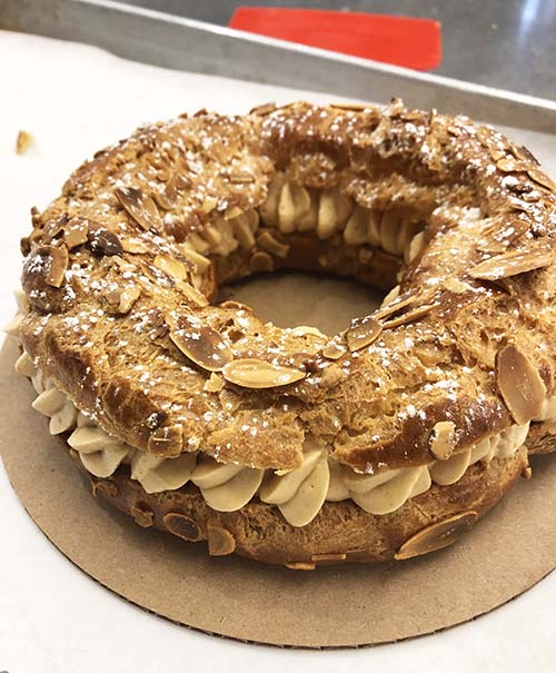 A traditional Paris-Brest with hazelnut praline filling