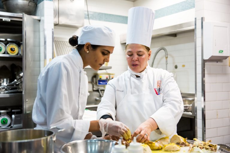 A student works with a chef