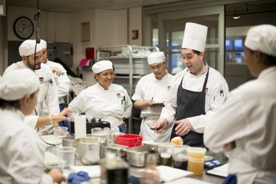 chef instructing culinary students in stock class