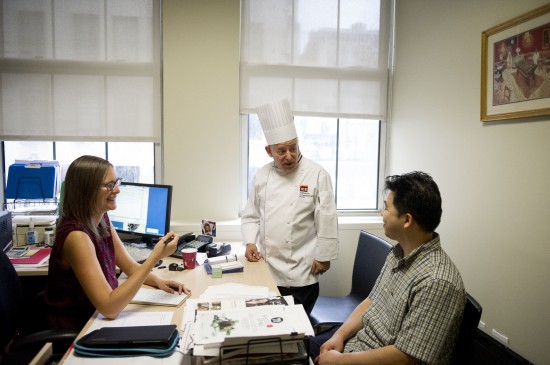 Instructors mingling with a culinary students