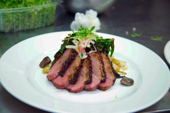 The seared rare duck breast with caramel glaze and braised duck leg with soy and spices.