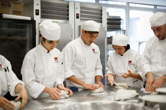 culinary students kneading bread