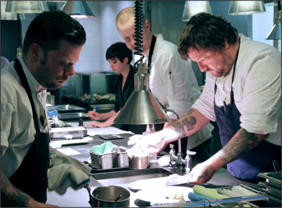 Chefs Erik Anderson and Matt Kirkley prepare for the dinner to honor Chef Tower.
