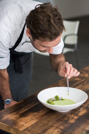 Chef Robert Ramsey plating english pea soup