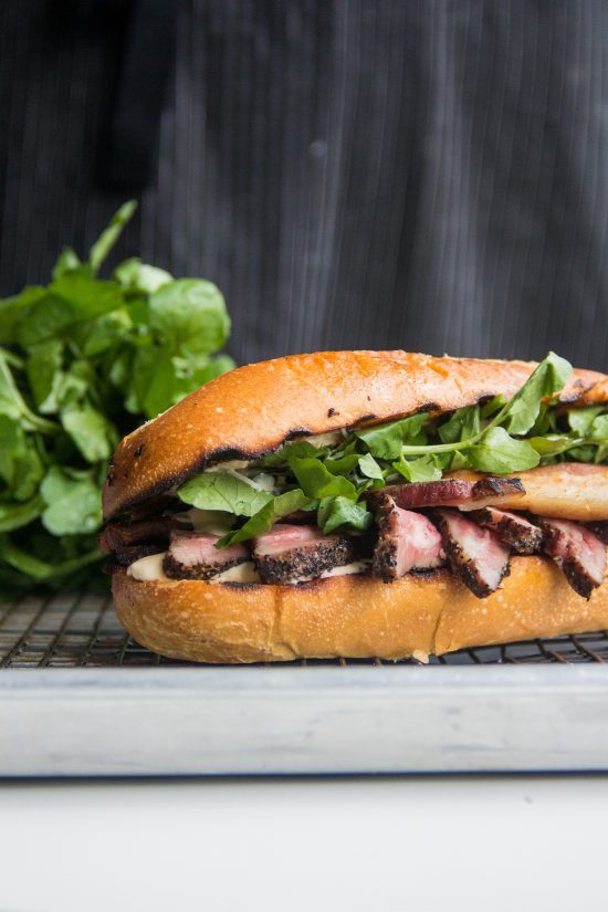sous vide peppercorn crusted flank steak sandwich with bacon