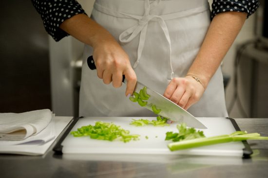 chef demonstrating their knife skills cutting celery in new york 