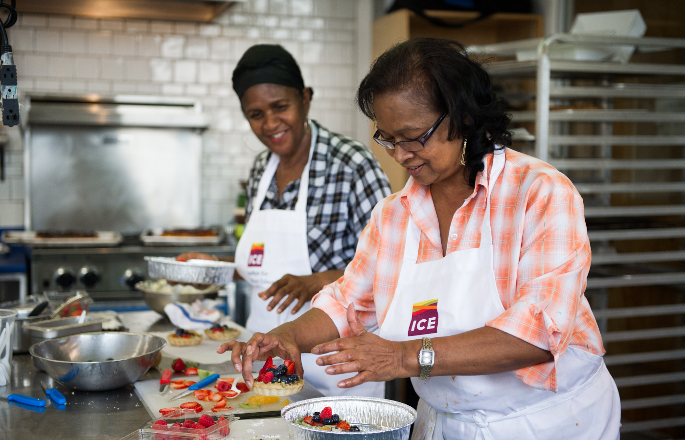 two women cooking in recreational kitchen