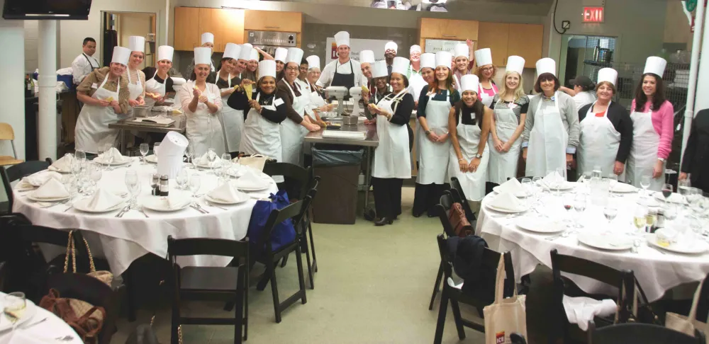school counselors learning to make pasta at ICE