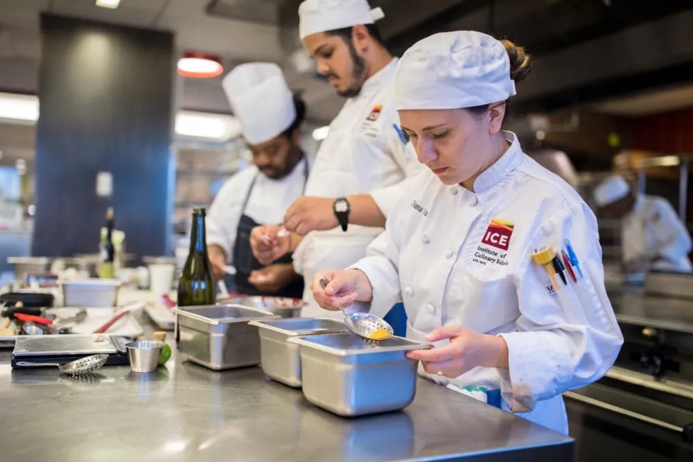 Two students and instructor at work