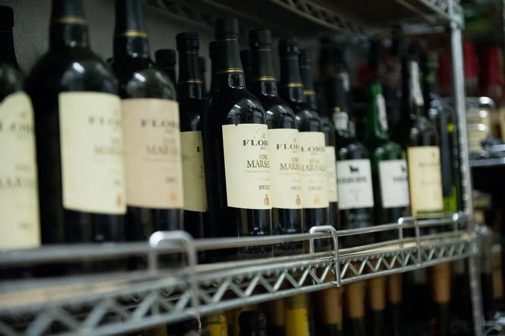 Bottles of Marsala wine on racks.