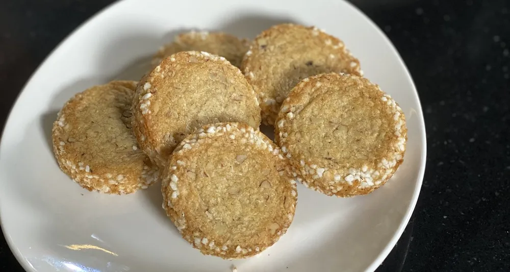 Pecan sable cookies on a white plate