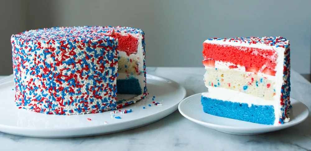 July Fourth red white and blue layer cake with funfetti, fresh fruit, icing and sprinkles