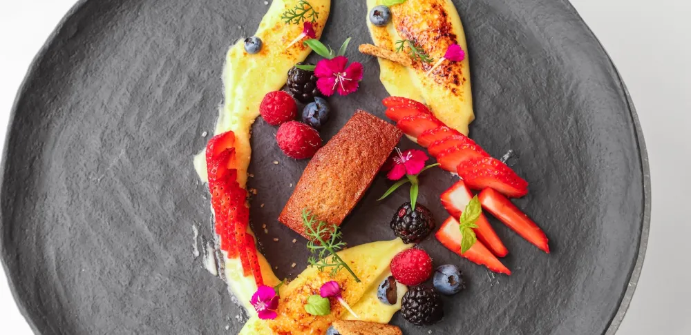 Chef Hervé's lime brulee sits on a grey plate
