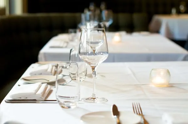 All white generic restaurant table setting.