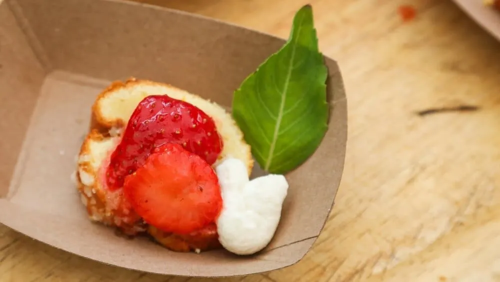 Strawberries and whipped cream atop a cake