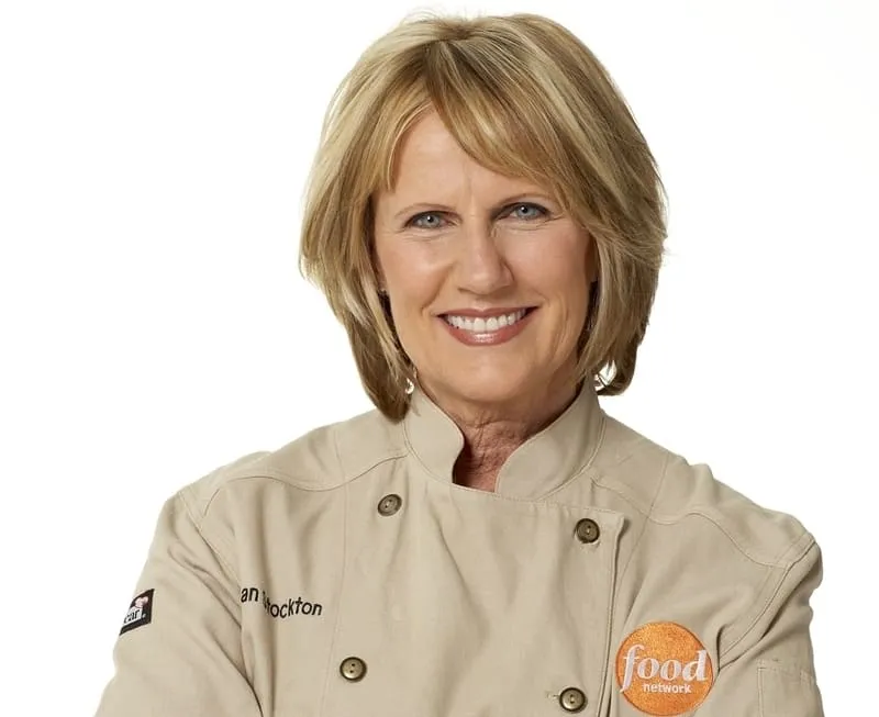 ICE grad Susan Stockton wearing beige Food Network chef coat.