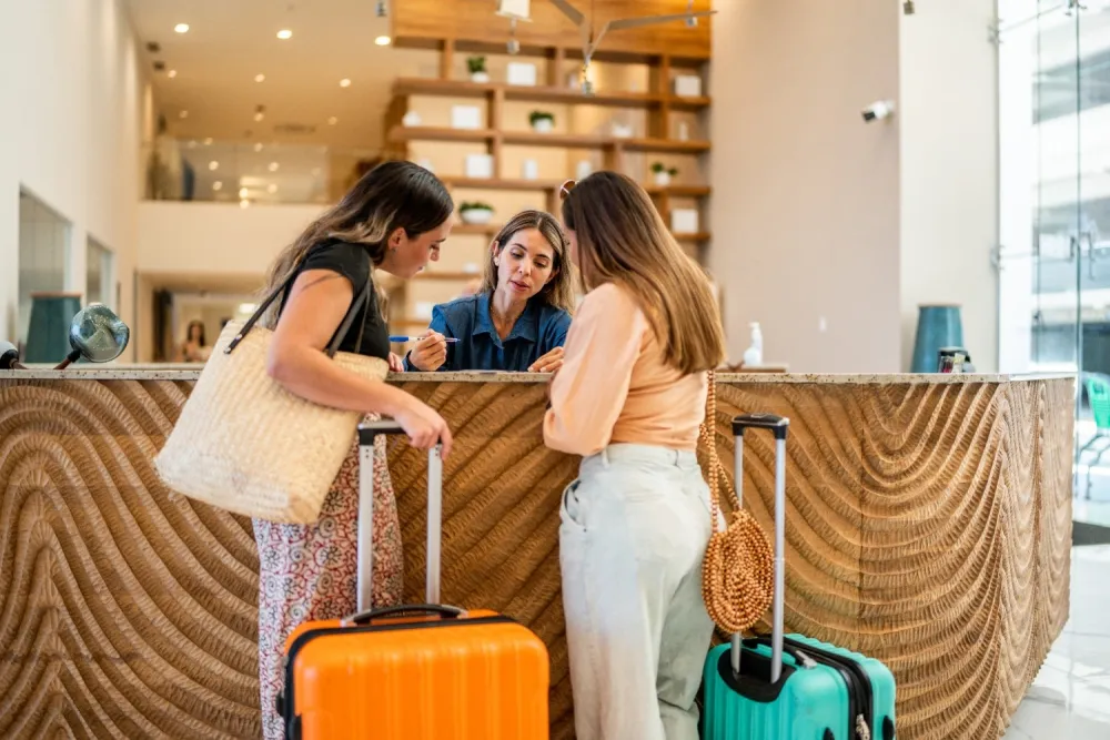 Two guests checking into a hotel