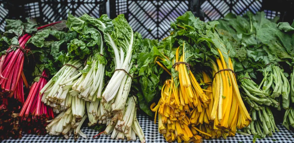Leafy green vegetables are displayed at the Greenmarket at Oculus Plaza.