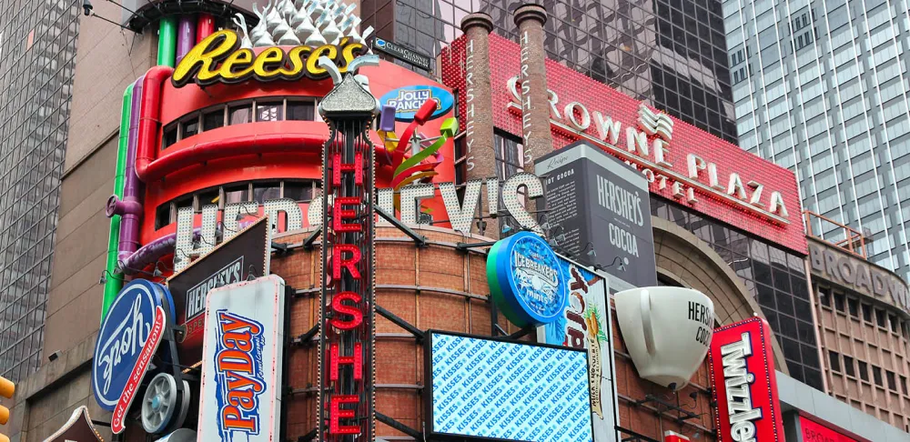 The Crowne Plaza Times Square Manahattan is next to Hershey's marquees in NYC.