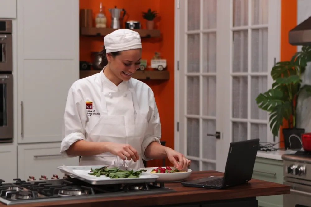 ICE online student plating a salad at home.