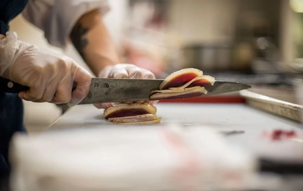 chef slicing fish