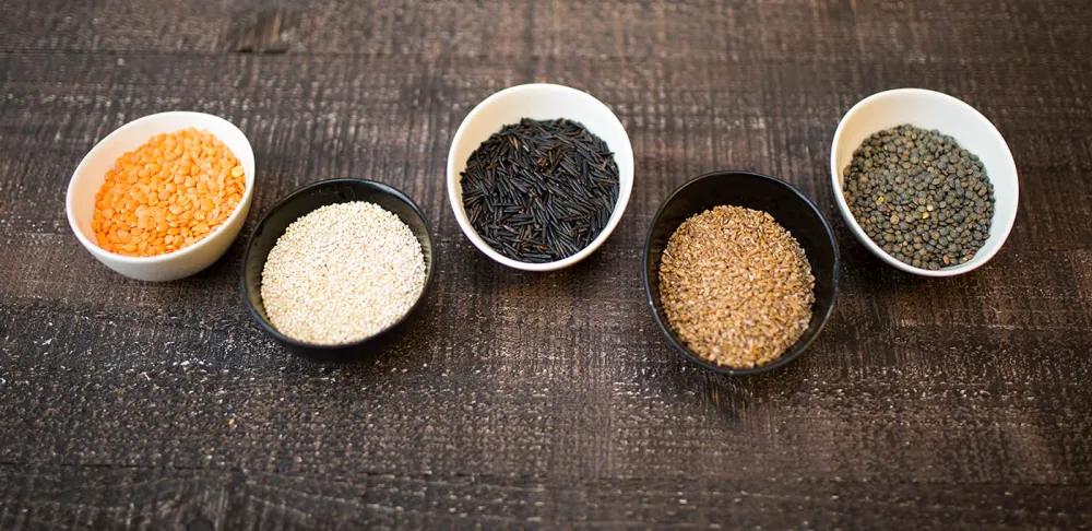 Bowls of whole grains and lentils