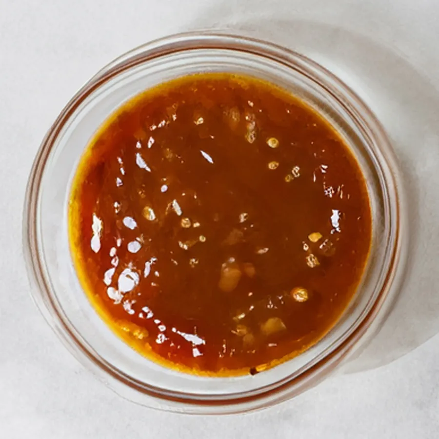 Small bowl of chicken pan sauce.