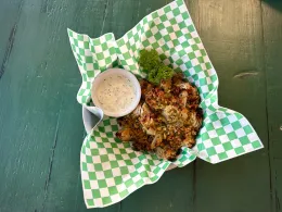 Fermented blooming onion served with ranch dressing.
