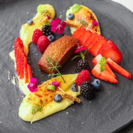 Chef Hervé's lime brulee sits on a grey plate