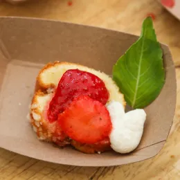 Strawberries and whipped cream atop a cake