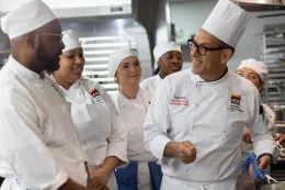 Students in a kitchen classroom. 