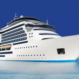 A cruise ship sails through the ocean blue