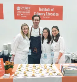 Students working at NYCWFF booth through ICE culinary volunteer resources